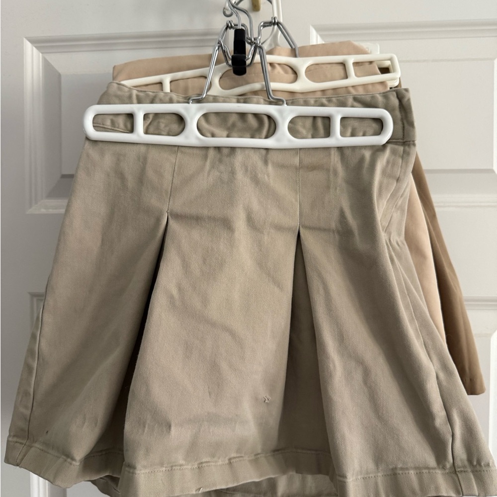 Bundle of 4 khaki skirts sizes 7 & 9
